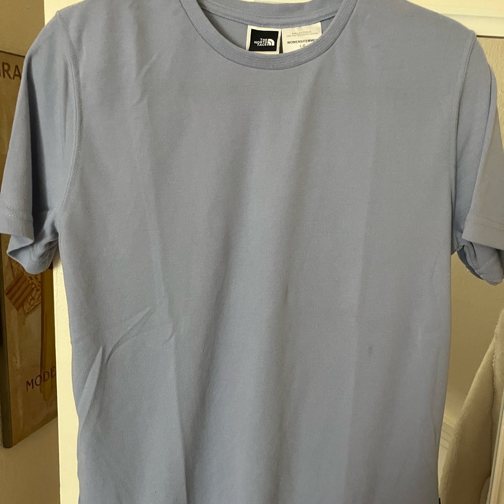 The North Face Blue Crew Neck Short Sleeve Tee for Women.